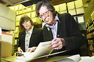 HRC librarian Elizabeth Murray (l) guides Booker Prize-winning author Penelope Lively through her early manuscripts.