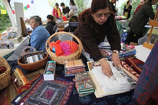 Holiday shoppers were treated to handmade wares at affordable prices at the annual Women and Fair Trade craft fair last weekend, sponsored by the American Friends Service Committee. At this booth, Lata Karna displays a selection of scarves.
