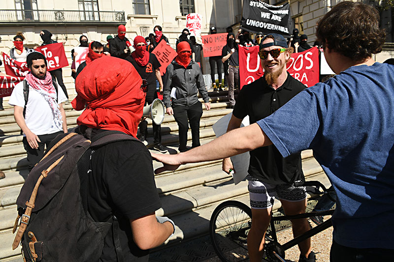 Red and the Modern Face of Agitators, disrupters, or “anarchists,” these masked represent a new resistance - News - The Austin