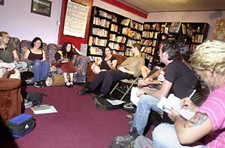 A July 30 collective meeting at MonkeyWrench Books, including a pre-mohawk Connor Hopkins (second from right) and Sarah Lange (second from left)