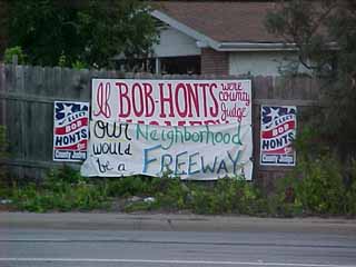  This sign near the Allandale exit of MoPac promoting the Republican candidate for Travis County Judge, originally read: If Bob Honts Were County Judge, You'd Be Home by Now. Apparently, someone in the neighborhood thought differently, and decided to let Road Warrior Honts know it. Incidentally, the person who sent us this photo is not a disinterested bystander: Gretchen Vaden Nagy is an employee of current County Commissioner Karen Sonleitner, a Democrat who herself is up for re-election. Nagy is also the Democratic Precinct Chair for Precinct 239.