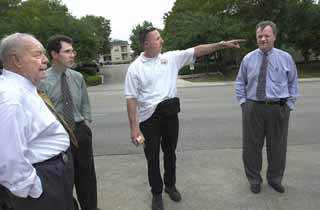 Former APD officer Timothy Enlow recounts one of the arrests that allegedly led to his dismissal. From left: arbitrator Harold Moore, assistant city attorney Mike Cronig, Enlow, and Enlow's attorney Mike Rickman.