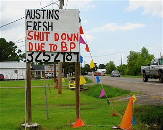 Roadside art at Southern Sting Tattoo Parlor along Louisiana Highway 1 in Larose, Louisiana.