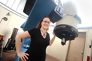 Blinded by the light: Lara Eakins of UT's astronomy department favors dimming the bulbs on campus.