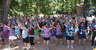 Zilker Park went decidedly mammalian as a dancing flash mob of about 200 converged on Barton Springs Pool to celebrate World Breastfeeding Week. Thanks, Mom!