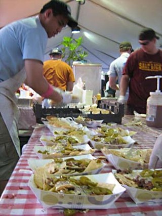 The Salt Lick crew prepares piles of sloppy nachos in advance of the lunch rush.
