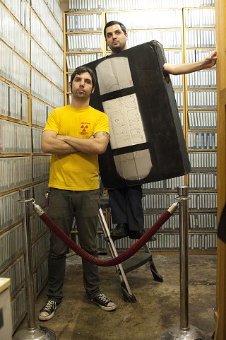 We'd watch 100 movies – and while you were doing that you'd <i>think </i>of another 100 movies. And we'd go to the video store and take home big, 30-gallon garbage bags full of videos to watch. And VHS tapes are really goddamn heavy when you've got that many in a plastic bag. – Bryan Connolly (r) on the research process; pictured with Zack Carlson (l) at Vulcan Video South