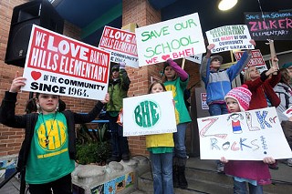 Students rally to save schools.