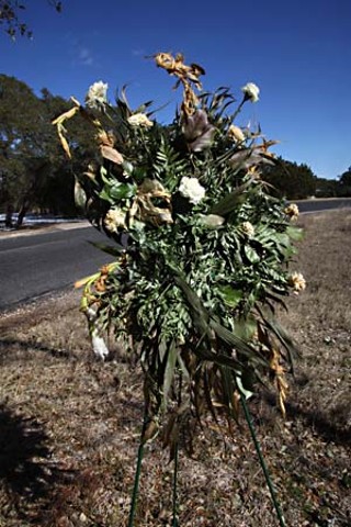 A wreath sits at the end of the driveway to the Maddox home.