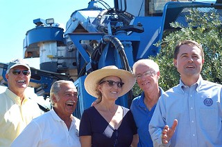 The Texas Olive Oil Council with Texas Agriculture Commissioner Todd Staples (r)
