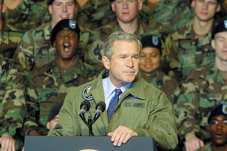 President Bush rallies the troops at Fort Hood for his invasion of Iraq. Bush told the assembled soldiers, Thank you for this jacket. I'm proud to wear it. Bush last wore a uniform in the Texas National Guard during the Vietnam era. He wasn't quite as proud of that one -- he was allegedly AWOL for about a year in the 1970s.