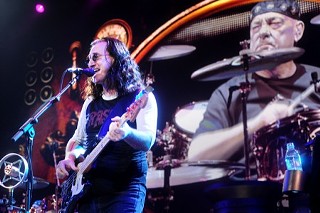 Big screen Neil Peart oversees Geddy Lee at Rush's Erwin Center shakedown, June 12.