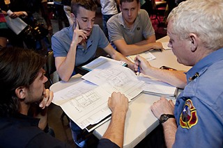 (l-r) Kent Roth, Collin Ballard, Ben May, and the Austin Fire Department's Lt. John Ham review schematics at last week's open house.