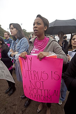 Despite loud opposition from women and Planned Parenthood advocates like Lesli Simms, shown above at a rally last February, the state of Texas continues battling the nearly 100-year-old organization.