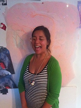 Tickled pink: Laughter erupts in the studio. Here, Solis stands in front of one of her larger Dura-Lar painted elements.