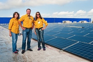 IKEA operations manager Amy Jensen surveys the sun-soaking tiles as they ready to produce electricity for the Round Rock IKEA store