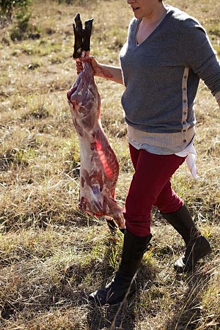 Morgan Angelone, Dai Due camp chef, preparing to butcher a pig
