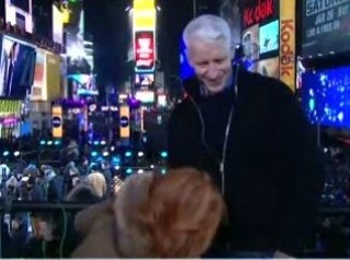 Kathy watches the New Year's Eve ball drop.