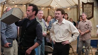 Boyd Crowder (Walton Goggins, left) challenges Rev. Billy St. Cyr (Joe Mazzello)