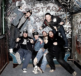 Couch surfing: (l-r) Kevin Curtin, Fritz, Kurtis Machler, Justin Collins, Reverend Johnson, and Gary Lindsey of Black Eyed Vermillion