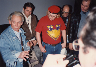 Cinema is like a battleground: love, hate, action, violence, death -- in one word, emotion. Fuller (l) wowed 'em at the 1998 Sundance Film Festival and signed a <i>Naked Kiss</i> poster for former <i>Chronicle</i> sports editor Scott Bowles (center): Scott, you like this movie -- don't try a sequel unless your head likes the thud of a phone.
