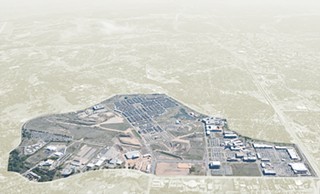 A south-facing aerial photo of Mueller shows the development in its present state, with old airport runways still visible.