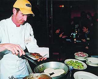 Lou Lambert prepares his  signature beef <i>salpicon</i> tacos at the January kickoff reception for the Texas Hill Country Wine and Food Festival's partnership with <i>Saveur</i>.