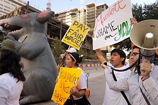 Texas Workers Defense members and supporters march from the JW Marriott construction site to City Hall on Aug. 8.