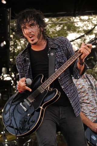 That’s Reignwolf, while he jerks around the stage alone, stumbling and stomping