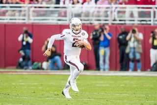 Johnny Manziel scampers for yards Saturday against Ole Miss