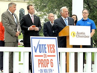 Sen. Kirk Watson, speaking, is joined by GOP Rep. Jason Isaac (c) and
former Greater Austin Chamber of Commerce Chair Clarke Heidrick (l)
at a Prop. 6 press conference Monday, the first day of early voting.