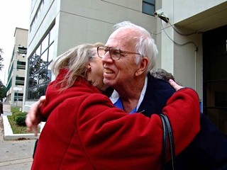 Fran and Dan Keller embrace outside the Travis County Jail