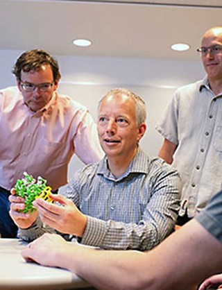 Jim Olson (center) and his team