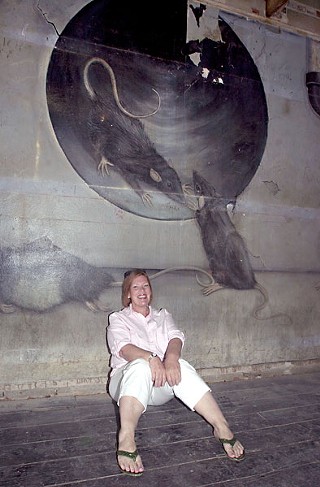 Moser in front of the iconic mural from Austin's birthplace of punk, Raul's, 2008