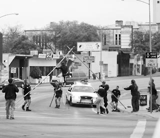 Last week eight protesters were arrested for setting up two tripods and a 25-foot banner reading, How many lives per gallon? at the intersection of Guadalupe and MLK. The group was arrested within minutes of launching its action, and charged with obstructing a roadway, a Class B misdemeanor. In dismantling the tripods -- manned by two female demonstrators -- APD did not use a net but simply pulled the legs outwards, causing one demonstrator to fall. The officers did not call EMS to the scene, but cuffed the demonstrator and carted her away. The other demonstrator voluntarily dismounted her tripod in order to avoid injury.