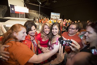 Texas running mates Wendy Davis and Leticia Van de Putte pose for photos with supporters celebrating Davis' one-year filibuster anniversary June 25 at Palmer Auditorium.