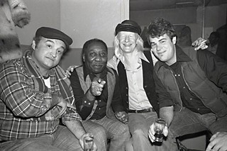 Blues Brothers: (l-r) John Belushi, Muddy Waters, Johnny Winter, and Dan Aykroyd