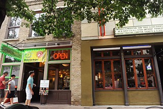 Developers plan to demolish the building at 619 Congress (l) to build a 32-story hotel; owners of the Hideout next door fear the demolition and construction will harm the building and their business.