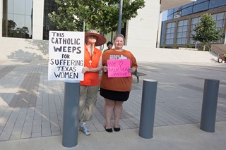 Pro-choice protesters gathered outside the courtroom on the first day of the HB 2 trial.