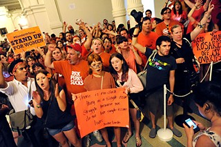 Pro-choice advocates protest HB 2 at the Capitol last summer.