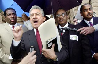 On the steps of the Capitol, Sen. Royce West (Dallas), Sen. Gonzalo Barrientos (Austin), Travis County Commissioner Ron Davis, and Sen. Rodney Ellis (Houston) express support for the Democratic state representatives who broke the House's quorum on Monday. Fifty-five reps intentionally went missing to stop House action on a Republican-led redistricting bill. For more, see Capitol Chronicle, below.