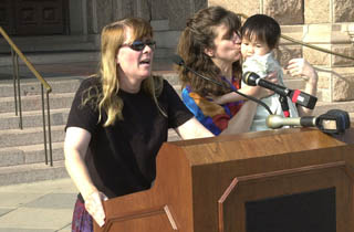Becky Harding (left), Becky Roberts, and their daughter Claire protest the so-called Defense of Marriage Act at the Capitol on Tuesday. The DOMA makes gay marriage, already illegal in Texas, even more illegal. Do all of you married heteros feel safer now?