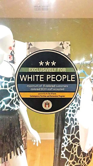Stickers placed on Eastside businesses