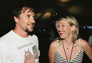 Reunited, and it feels so good: <i>Dazed and Confused </i>director Richard Linklater and cast member Joey Lauren Adams at the movie's 10th anniversary screening/lake party