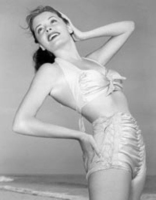 Actress Jane Greer strikes a swim pose.