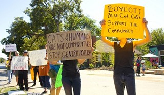 Protesters this weekend outside of the newly opened Blue Cat Cafe. Its parking lot is the former site of Jumpolin.