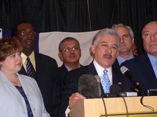 Austin state Sen. Gonzalo Barrientos addresses the media in Albuquerque, backed by his Democratic colleagues.
