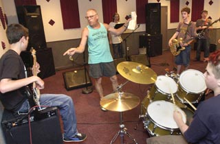Teacher Alvin Crow directs the overnight campers in Pitchatent. L-R: Malcolm, Alvin, Tim, Noah, Daniel, Eric.
