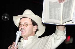 Jim Hightower rallies the crowd against Wal-Mart at a benefit screening last week of the documentary <i>Store Wars: When Wal-Mart Comes to Town</i>. The Austin author is reading from a chapter on Wal-Mart in his latest book,<i> Thieves in High Places: They've Stolen Our Country and It's Time to Take It Back</i>.