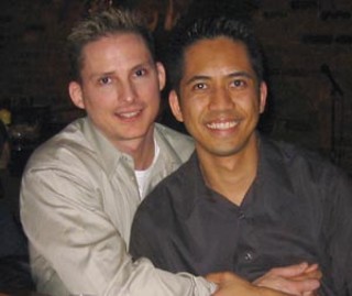 Dewayne Friar (l), the off-duty gay cop who was 
roughed up in the Warehouse District, with his 
partner Romer Galang.<br>(photo courtesy of 
Dewayne Friar)